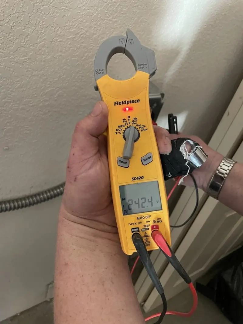 Voltage testing with clamp meter during Ceiling Fan Installation in Fox Lake